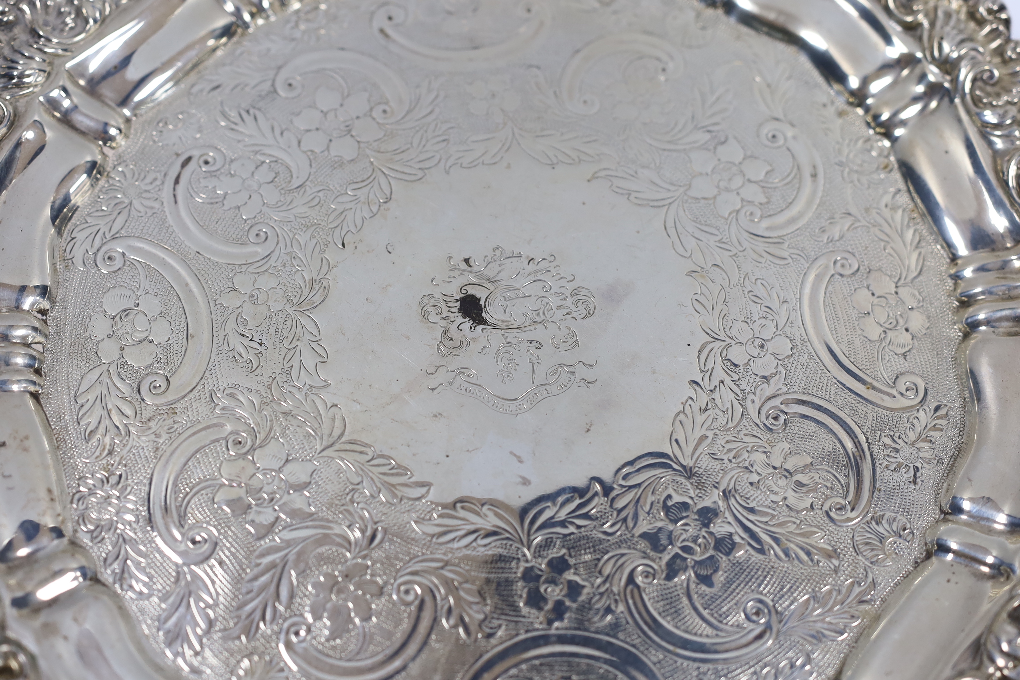 An early 19th century engraved silver salver, marks rubbed, 30.8cm, 26oz.
